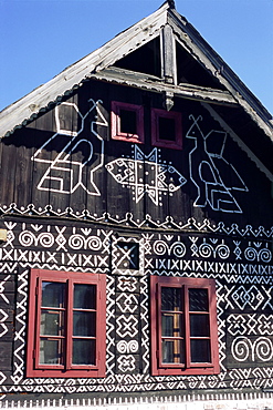 Unique decoration of houses based on patterns used in traditional embroidery in village of Cicmany, UNESCO World Heritage Site, Zilina region, Slovakia, Europe