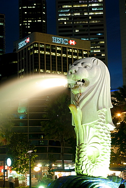 Merlion fountain with statue of half lion and fish, that has become a symbol of Singapore, with City buildings beyond, Singapore, Southeast Asia, Asia