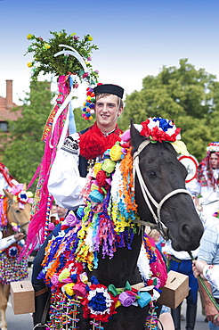 Man riding horse and wearing folk dress during festival Ride of the Kings, Vlcnov, Zlinsko, Czech Republic, Europe