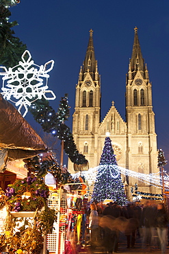 Christmas market and neo-gothic Church of St. Ludmila, Mir Square, Prague, Czech Republic, Europe 