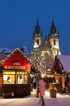 Snow-covered Christmas Market and Tyn Church, Old Town Square, Prague, Czech Republic, Europe