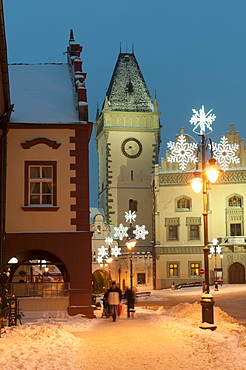 Snow-covered Christmas decorated lamps and Gothic Town Hall, Tabor, Jihocesky, Czech Republic, Europe 