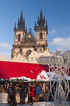 Snow-covered Christmas Market and Tyn Church, Old Town Square, Prague, Czech Republic, Europe 