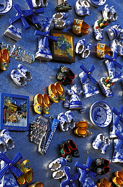 Overhead view of ceramic magnet souvenirs of clogs and windmills for sale, Amsterdam The Netherlands (Holland), Europe