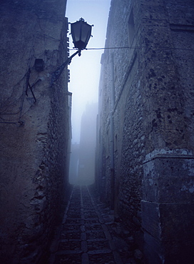 Narrow misty cobbled street, Erice, Sicily, Italy, Mediterranean, Europe