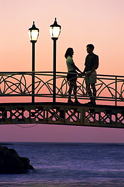 Couple on bridge, Aruba, West Indies, Dutch Caribbean, Central America