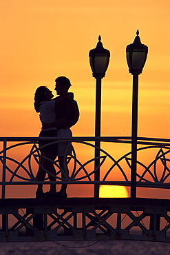 Couple on bridge, Aruba, West Indies, Dutch Caribbean, Central America