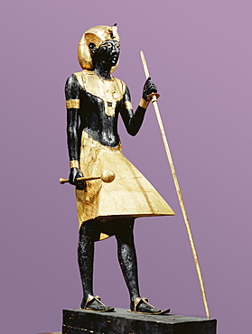 Life size statue of Tutankhamun made from black wood with applied gilded plaster, from the tomb of the pharaoh Tutankhamun, discovered in the Valley of the Kings, Thebes, Egypt, North Africa, Africa