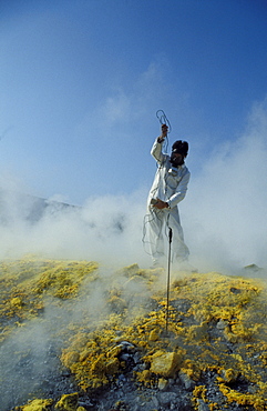 Researcher's checking fumarole, CNR volcanology research, Aeolian Islands, Sicily, Italy