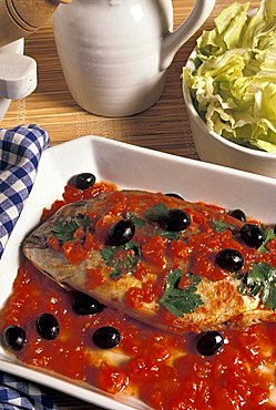 Dentex with tomatoes and black olives, Italy