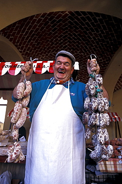 Sausage merchant at truffle fair, Villafranca d'Asti, Piedmont, Italy.