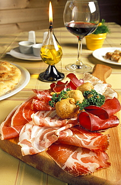 Chopping board with salami, Al Frodolfo restaurant, Santa Caterina Valfurva, Lombardy, Italy