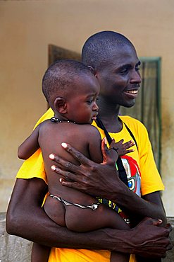 Man with child, M'Bour, Republic of Senegal, Africa