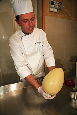 Chocolate egg is ready for decoration, Easter egg preparation, Bar Centrale, Lecco, Lombardy, Italy