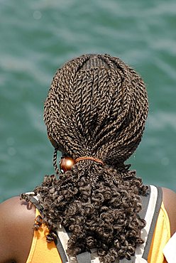 A woman with braided hair , Republic of Senegal, Africa