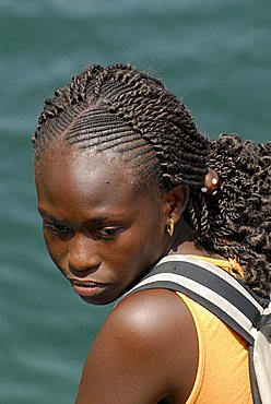 A woman with braided hair , Republic of Senegal, Africa