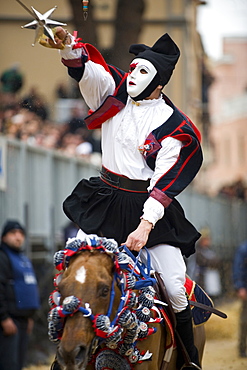 Horseman gallops to pierce the star with his sword, Sartiglia feast, Oristano, Sardinia, Italy, Europe