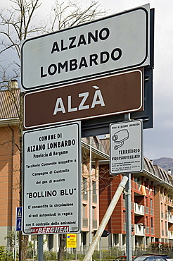 bilingual road signal, alzano lombardo, italy