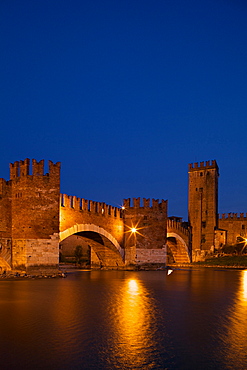 Scaligero bridge or Ponte Vecchio bridge over the Adige river near Castelvecchio castle by night,  Verona, Veneto, Italy, Europe