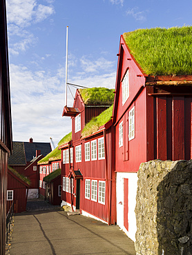 Peninsula Tinganes with old town and the red houses of the government district. Torshavn (Thorshavn) the capital of the Faroe Islands on the island of Streymoy in the North Atlantic, Denmark, Northern Europe