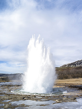 The geothermal area in Haukadalur during winter, part of the tourist route Golden Circle. The geysir Strokkur. europe, northern europe, scandinavia, iceland,  March