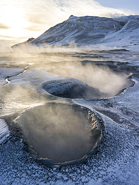 Geothermal area Hveraroend near lake  Myvatn and the ring road during winter with mud pools , fumaroles and solfataras.  europe, northern europe, scandinavia, iceland,  February