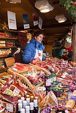 The Christmas Market in Sterzing (Vipiteno) in the medieval historic center. Booth selling local meat products. Europe, Central Europe, Italy, South Tyrol, December