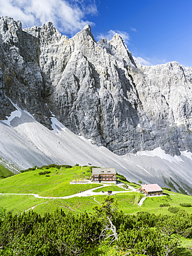 Karwendel Mountain Range,  the peaks towards Mt. Bockkar-Spitze and the mountain hut Falkenhuette, Austria.    The mountain hut Falkenhuette is a popular destination for climbers, mountainbiker and hiker. The Karwendel limestone mountain range is the largest range in the eastern alps. Large parts of the Karwendel are protected and a popular destination for tourists, hikers and climbers. Europe, Central Europe, Austria, Tyrol, July