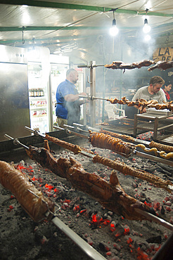 Porceddu, roast baby pork wrapped around a spit, Cordula made up of braided and cooked kid or lamb intestines wrapped around a spit, typical Sardinia recipe, Campidano, Sardinia, Italy, Europe