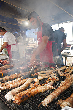 Cordula made up of braided and cooked kid or lamb intestines wrapped around a spit, typical Sardinia recipe, Campidano, Sardinia, Italy, Europe