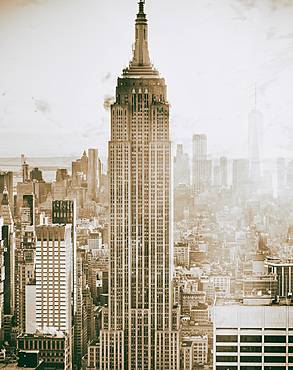 Manhattan skyline at dusk, aerial view of New York buildings.