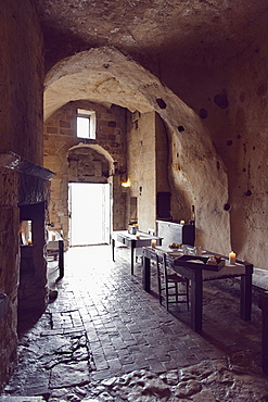 Dining rooms of the hotel Le Grotte della Civita, It is a hotel housed in ancient cave houses by the projects of "Sextantio", Matera, Basilicata, Italy, Europe