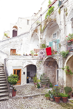 View of a typical open courtyard the historic center of Matera, Basilicata, Italy, Europe