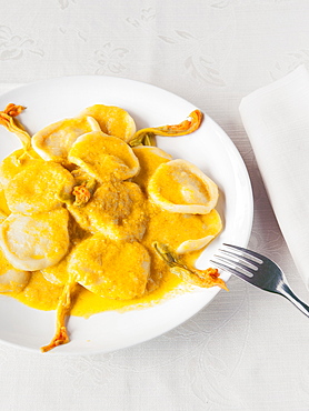 Hand made pasta with zucchini flowers souce and fresh zucchini flowers, Il Giardino Di Epicuro restaurant, Maratea, Basilicata, Italy, Europe