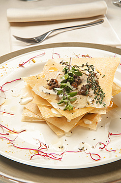 Millefeuille of lasagna with blue cheese fondue and red spotted cow rag˘; Osteria Il Balivio, route Ramey 102; Champoluc Ayas; Aosta; Italy; Europe