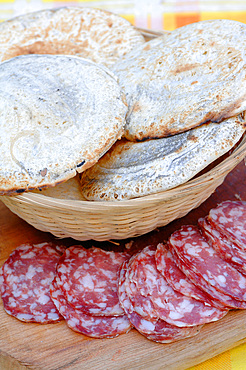 Panigaccio is a type of round, unleavened bread, baked in a special terracotta and mica dish, called testo, red-heated over high heat in a bonfire or in a wood-burning oven. A batter of flour, water and salt is interposed between one text and another, to form a pile. It is typical of the Lunigiana land on the border between Liguria and Tuscany, Italy, Europe