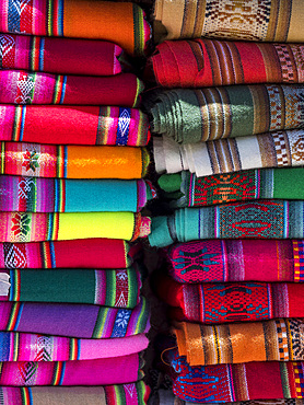 Colorful scarfs or blankets for tourists. Town Humahuaca in the canyon Quebrada de Humahuaca. The Quebrada is listed as UNESCO world heritage site. South America, Argentina, November