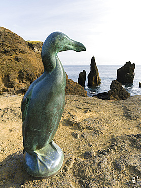 Monument for the extinct great auk (Pinguinus impennis), created by Todd McGrain. Coastal landscape at Reykjanesviti and Valahnukur on Reykjanes peninsula. europe, northern europe, iceland, august