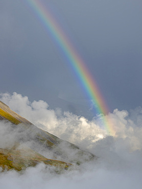 Landscape with rainbow and clouds in the National Park Hohe Tauern (High Tauern) near Franz-Josephs-Hoehe. Europe, Austria, Carinthia