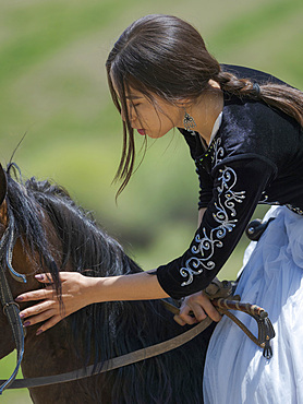 Kyz kuumai, bridegroom chasing the bride, a traditional equestrian sport. Folk Festival commemorating the origin myth the Tien Shan Maral (Tian Shan wapiti), an origin myth of the Kyrgyz tribes. Near Tasch Baschat, Naryn region. Asia, Central Aisa, Kyrgyzstan