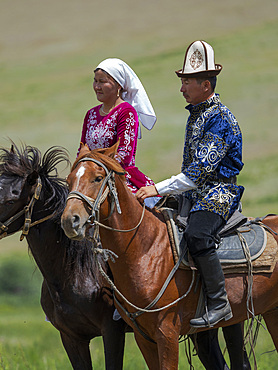 Kyz kuumai, bridegroom chasing the bride, a traditional equestrian sport. Folk Festival commemorating the origin myth the Tien Shan Maral (Tian Shan wapiti), an origin myth of the Kyrgyz tribes. Near Tasch Baschat, Naryn region. Asia, Central Aisa, Kyrgyzstan