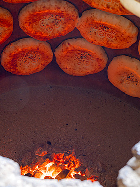 Typical, Traditional bakery making Lepjoschka bread in a clay oven. City Jalal-Abad (Dzhalal-Abad, Djalal-Abat, Jalalabat) in the Fergana Valley close to the border to Uzbekistan. Asia, central Asia, Kyrgyzstan