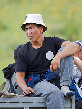 Visitor on truck. Folk and Sport festival on the Suusamyr plain commemorating Mr Koshomkul, a sportsman and folk hero of the last century. Asia, central asia, Kyrgyzstan