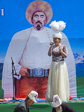 Musician in traditional garment. Folk and Sport festival on the Suusamyr plain commemorating Mr Koshomkul, a sportsman and folk hero of the last century. Asia, central asia, Kyrgyzstan