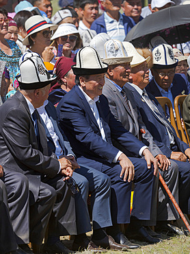 Man with traditional white felt hat, Kalpak. Folk and Sport festival on the Suusamyr plain commemorating Mr Koshomkul, a sportsman and folk hero of the last century. Asia, central asia, Kyrgyzstan