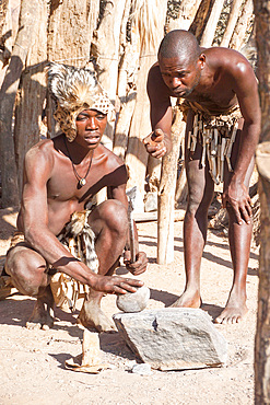 Craftsman of Tribu 'Damara at work, UNESCO World Heritage Site, Twyfelfontein, Damaraland, Namibia, Africa