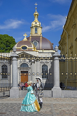 Two people in period dress by the Cathedral, Peter and Paul Fortress, St. Petersburg, Russia, Europe