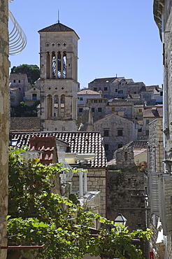 Rooftop view over the roofs to the bell tower of St. Stephens Cathedral in the medieval city of Hvar, island of Hvar, Dalmatia, Croatia, Europe