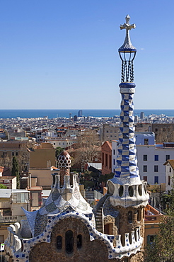 Multi coloured and patterned glazed ceramic work decorates a roof in Parc Guell, designed by Antonio Gaudi, UNESCO World Heritage Site, Barcelona, Catalunya, Spain, Europe 