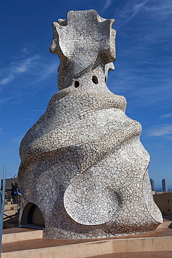 Large chimney inlaid with random cut white glazed tile, roof of La Pedrera (Casa Mila), an apartment house designed by Antonio Gaudi, UNESCO World Heritage Site, Passeig de Gracia, Barcelona, Catalunya, Spain, Europe 